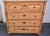 This splendid four drawer chest has a slightly breakfront case, the deep top drawer with oval panels protruding a little...