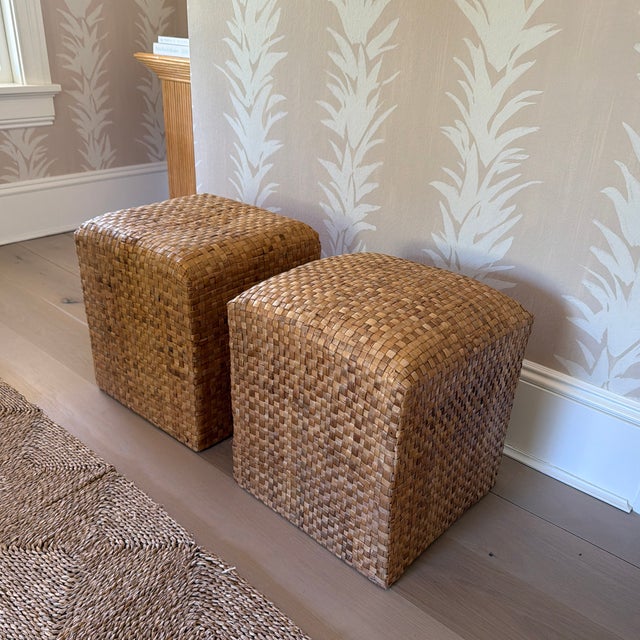Wonderful pair of woven natural fiber cube ottomans. I am not sure of the material, but it is some kind of tropical fiber...