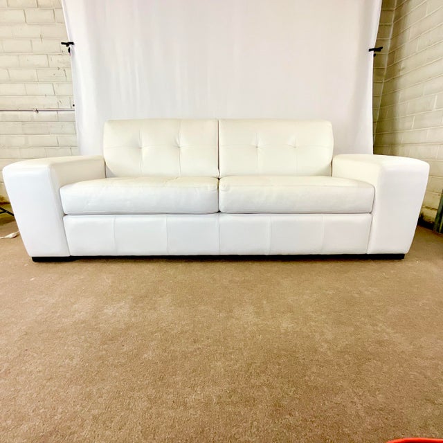 Vintage Home is pleased to present this Contemporary White Leather Sofa in the manner of Knoll. We love statement pieces...