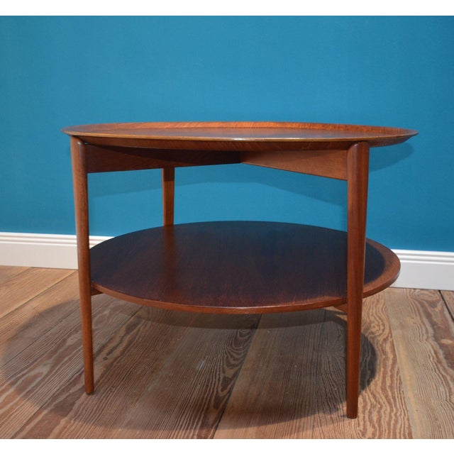 A beautiful teak side table. Tray table from the 1960s. Made in Sweden. Solid teak frame with removable serving tray....