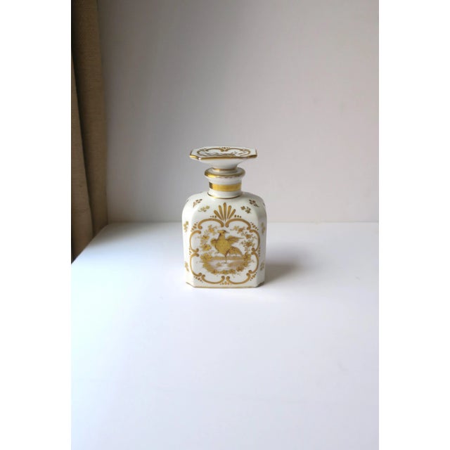A very beautiful Italian white and gold porcelain vanity bottle with bird design in the Rococo style, circa early-20th...