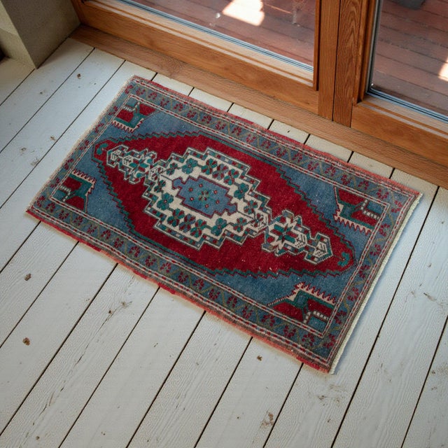 Vintage Turkish hand-knotted small rug from Oushak, 1960s, featuring warm brick-red tones and authentic village...