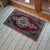Vintage Turkish hand-knotted small rug from Oushak, 1960s, featuring warm brick-red tones and authentic village...