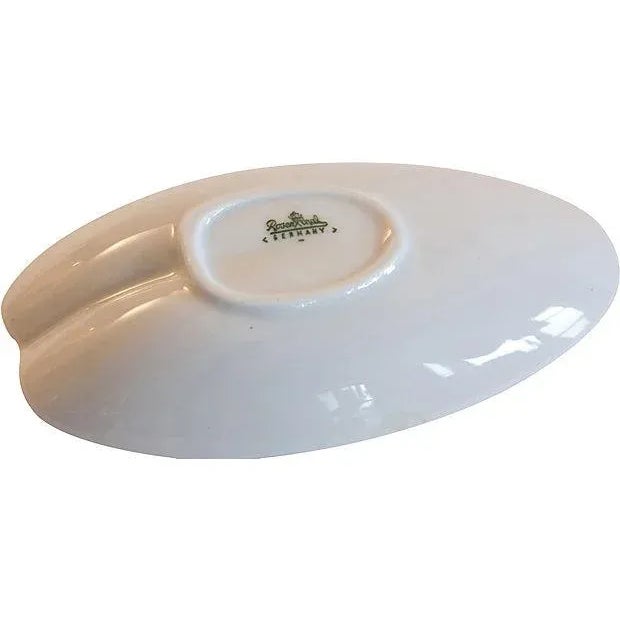 A Mid Century Modern pair of Tapio Wirkkala for Rosenthal porcelain leaf dishes. This is the larger size and from the 1960s.