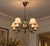Nordiska Kompaniet, Chandelier, Green Lacquered Wood, Brass, Sweden, 1950s An elegant Swedish chandelier designed and...