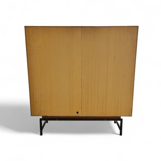 Sleek and minimalist in design this large cabinet, designed by Günther and Brechtmann for Fristho in 1961, is made of teak...