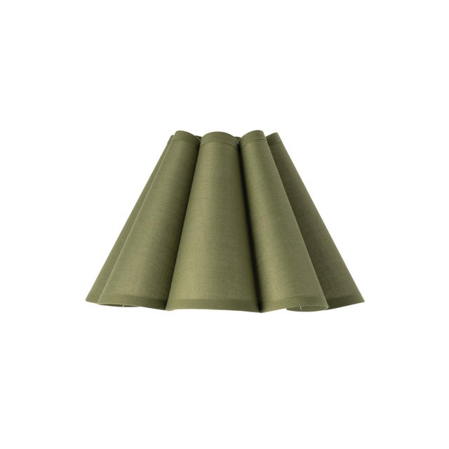 Crafted from linen in a soft Olive hue, the Polly Alternate Shade features a gently scalloped form that adds quiet...