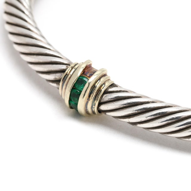 Stones: emerald round Circumference: 6.5 in w/ 1 in opening Width: 5.1 mm Weight: 18.3 dwts. / 28.5 grams Stamps: "585 925...