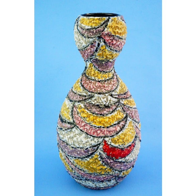 Measurements: height: 26 cm; diameter: 13 cm; weight: 0.977 kg important ceramic art vase, modeled and decorated entirely...