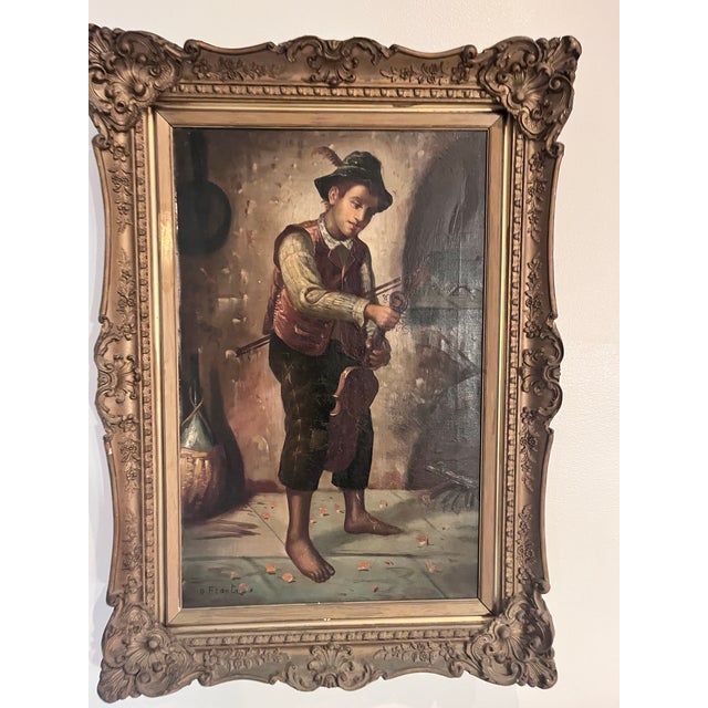Charming antique European oil on canvas depicting a young violinist tuning his instrument. Executed in the academic genre...
