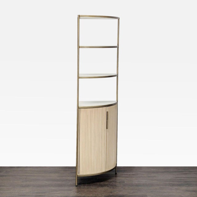 This Crate & Barrel bookshelf features a sleek metal frame and three open shelves, perfect for displaying books or decor....