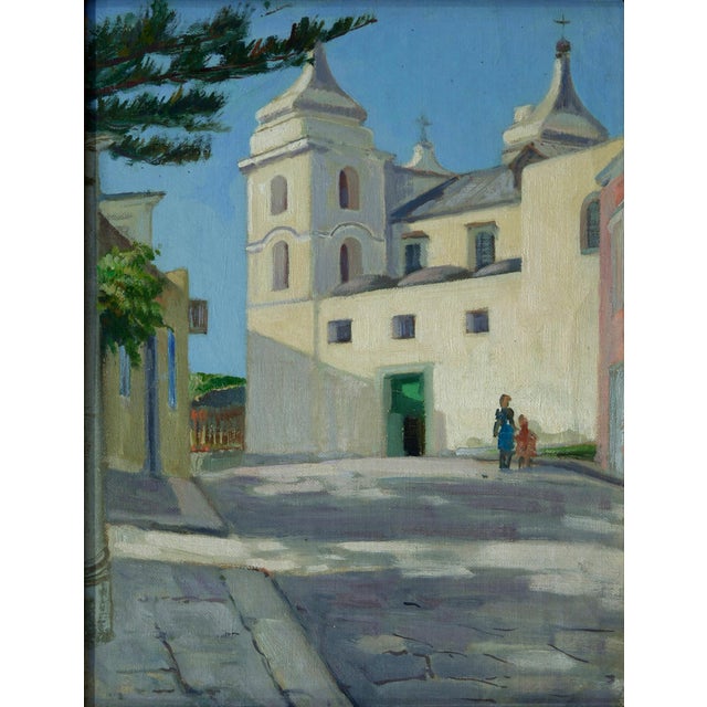 A charming Italian street scene by Alfredo Mahieux depicting a sunlit church square in Ischia, dated 1949. This refined...