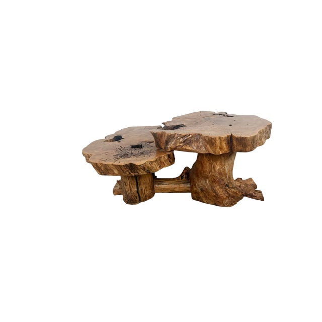 Two thick wood slabs meet at staggered heights in this vintage live-edge coffee table. Each top follows the irregular...