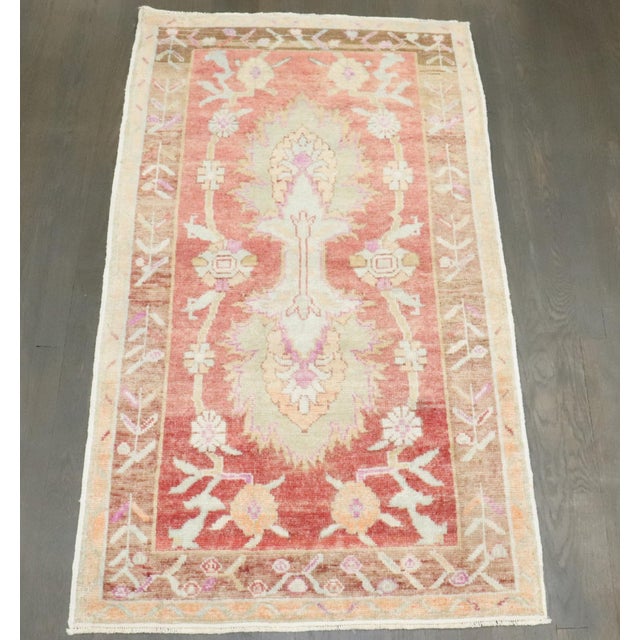 A mid 20th century turkish anatolian rug in soft warm tones