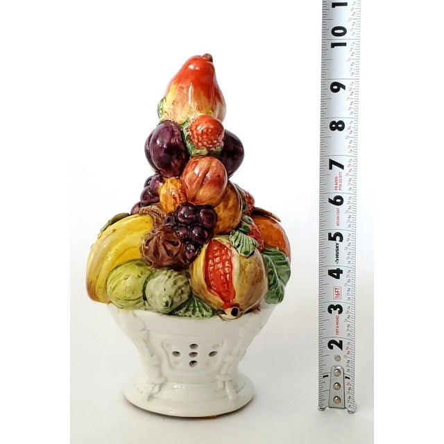 Offering a 1960s SMALL Italian porcelain hand painted topiary depicting a white basket filled with an array of fruits...