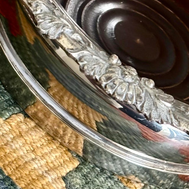 Antique English SilverPlate magnum wine coaster featuring an ornate grapevine repoussé rim. Built with a heavy,...