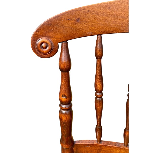 This chair is an antique American Empire-style caned spindle-back side chair, also sometimes referred to as Victorian...