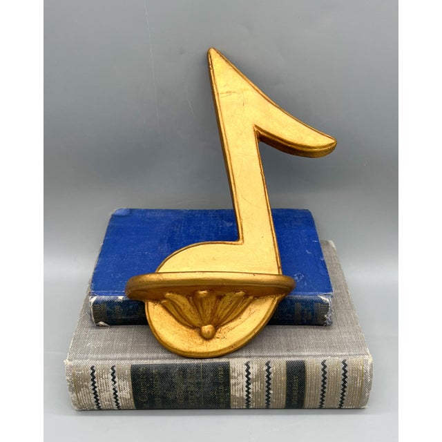 Lovely and intricate plaster bracket shelf with bright gold gilding. Made circa the mid 20th century. Gorgeous music not...