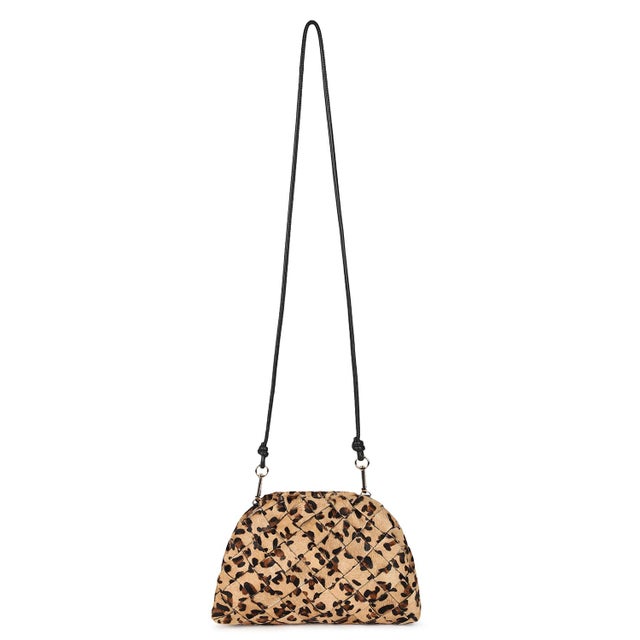 The AYA Frame clutch is crafted from handwoven leopard-print calf hair. It’s the perfect bag when you don’t want to carry...