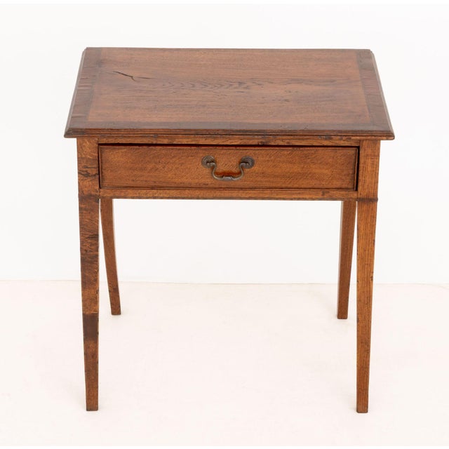 Federal Style Oak Side Table, with walnut banded edge and single drawer on four tapered legs. 28.25" H x 27" W x 18.75" D....