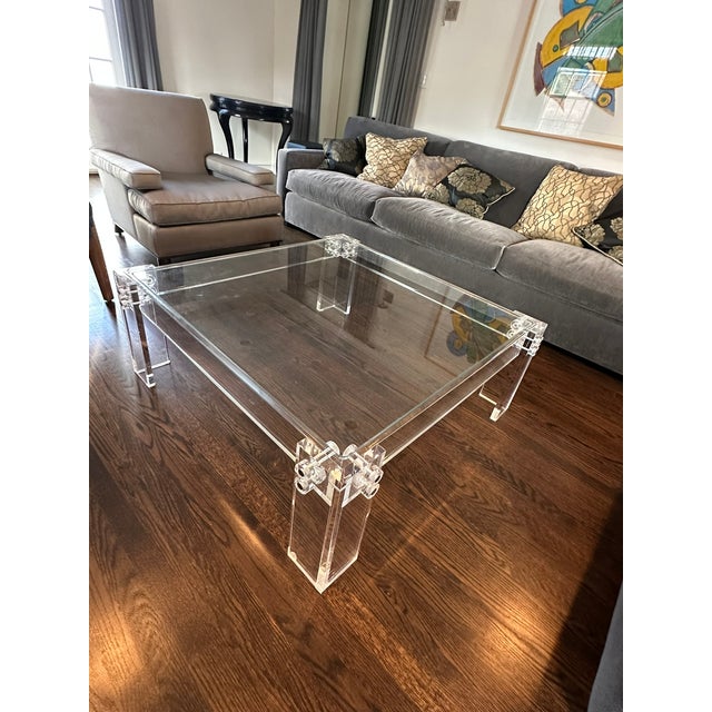 Designer Acrylic Coffee Table — Merchandise Mart Chicago A sleek and sculptural acrylic coffee table sourced from...