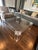 Designer Acrylic Coffee Table — Merchandise Mart Chicago A sleek and sculptural acrylic coffee table sourced from...