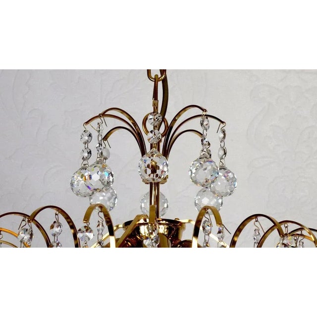 Beautiful chandelier, which has an impressive design off and throws very nice light even when the condition is switched on...