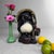 Japanese tanuki statue made of Shigaraki ware, dating from circa 1960, Shōwa period, Japan. The figure is finished in dark...