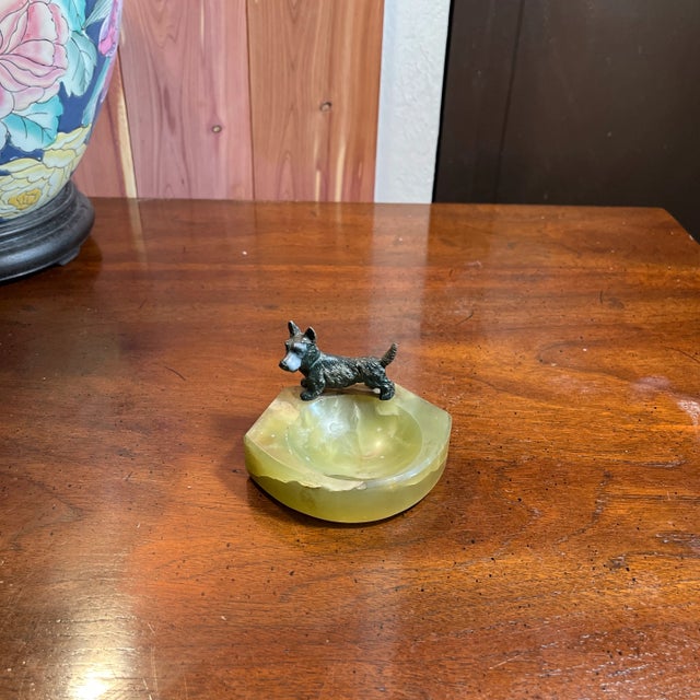 Adorable art-deco style whimsical ashtray. The green onyx has a translucent marble swirl feel which provides a nice base...