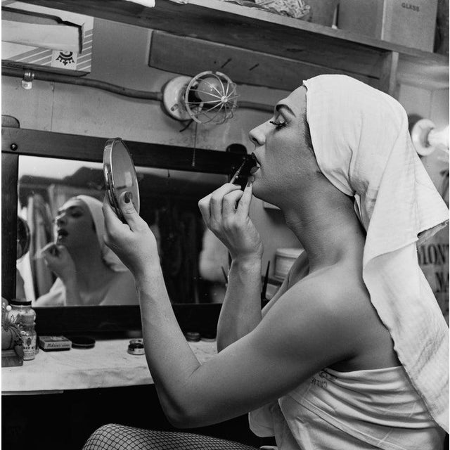 Female Impersonator A female impersonator applying make-up backstage, circa 1955. (Photo by Nathan/Graphic House/Archive...