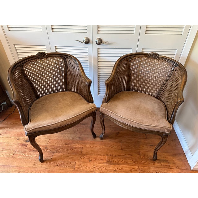 A pair of French Louis XV style , with their blend of cabriole legs and carved crests, suggest a style that draws from the...