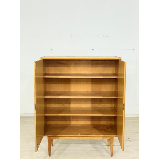 Beautiful Hellerau vintage cabinet in good condition. • German Design • 1960s Original • Very good condition • Ash • Key...