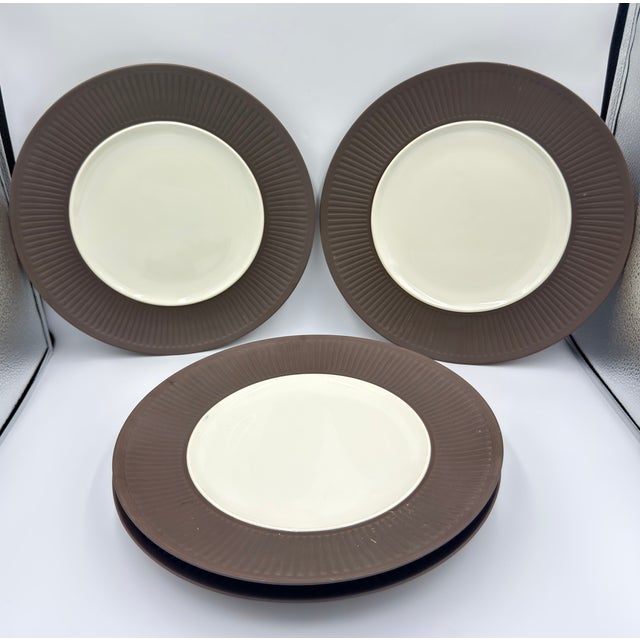 The Dansk Fluted Flamestone Brown dinner plates are an iconic mid-century modern set designed by Jens Harald Quistgaard...