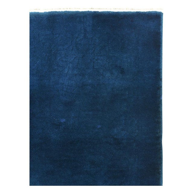 A vintage Chinese Art Deco throw rug handmade during the mid-20th century in blue. Measures: 2' 11" x 4' 10".