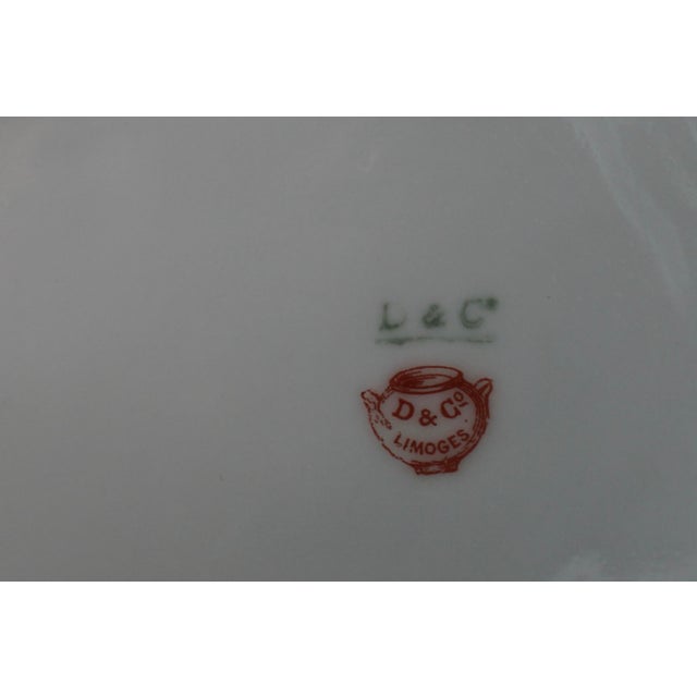 Bring timeless French elegance to the table with this exceptional antique D & C Limoges porcelain serving tray,...