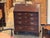 George III mahogany fall-front desk with a fitted interior of small drawers, open compartments, and a central cupboard...