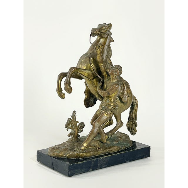 Vintage Doré Bronze Marly Horse Sculpture, After Guillaume Coustou the Elder (French, 1677-1746) at the entrance to the...