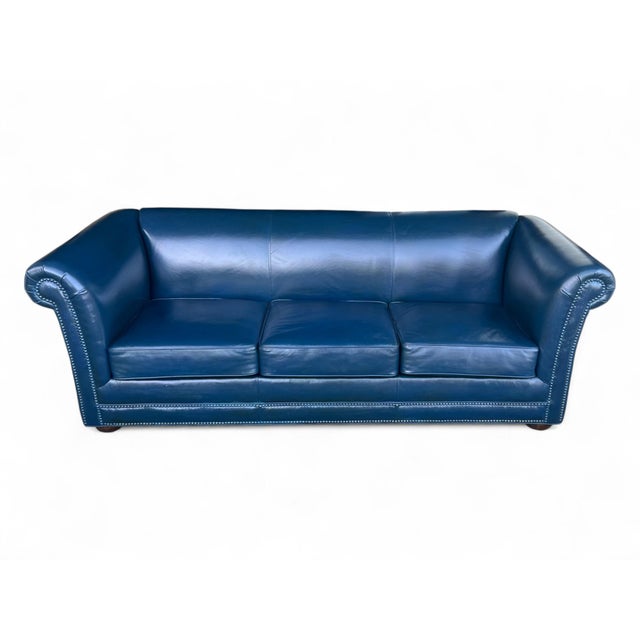 This eye catching navy blue leather loveseat combines a classic silhouette with a rich, distinctive color. Its rolled arms...