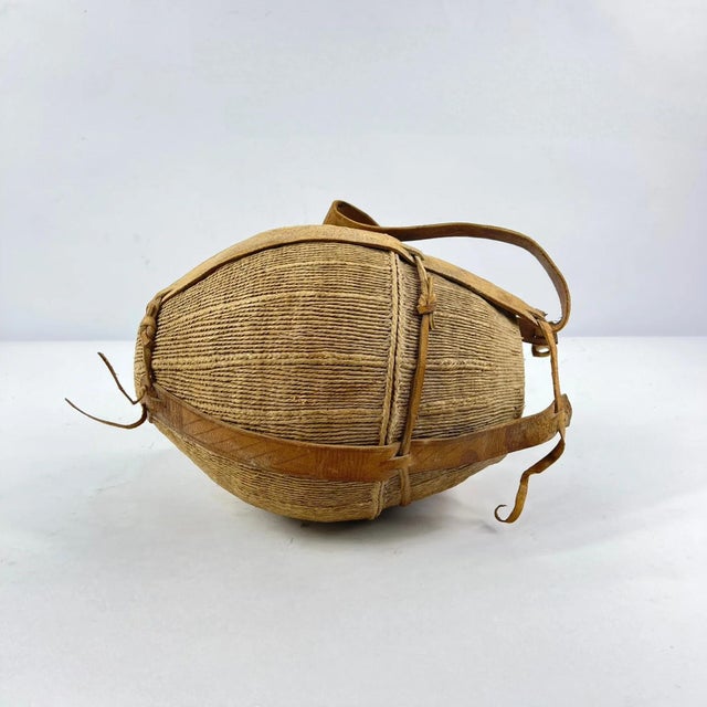 Traditional milk jug used by theÂ Borana people of Kenya. These vessels were typically carved from wood or made from gourd...