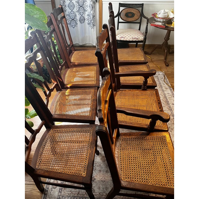 Set of 8 Eastlake circa 1890 dining chairs with woven seats & purple covers to protect the weave. They captain chair is 21...