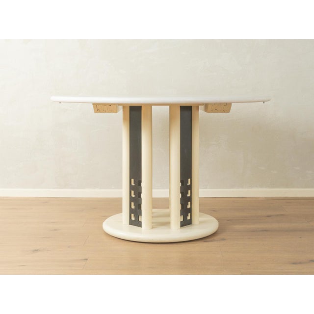 Postmodern extendable dining table by Thonet from the 1980s. High-quality frame with white-stained tabletop and extension...