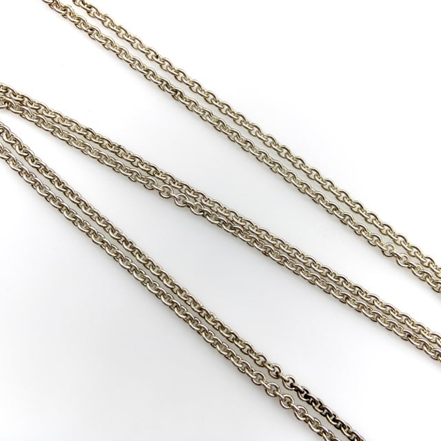 This vintage sterling silver chain consists of interlocking circular belcher links. It has a great long length of 34” and...