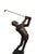 The golf lover carved wooden figural sculpture of a swinging golfer makes a playful decorative accent for a library, den...