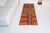 This is a vintage Turkish Oushak rug from the Mid 20th Century. The piece was hand-knotted.