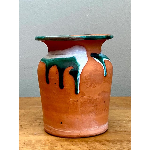 Handcrafted during the mid-20th century, this vintage terracotta vase highlights the rustic warmth and organic beauty of...
