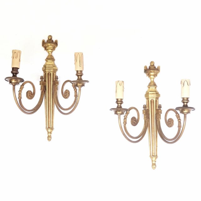 Pair of gilt bronze wall sconces 20th century Louis XVI style, France Burning and matte finish on the bronze. Weight of 1...