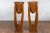 A pair of Javanese Art Deco style teak wood plant stands from the 20th century, with tall proportions, horizontal brass...