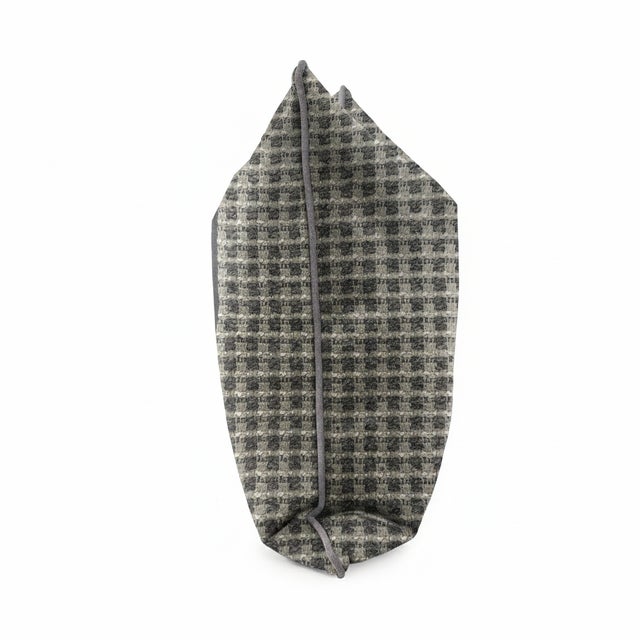 This fabric features a modern twist on a classic houndstooth pattern, woven in rich navy and ivory tones. The textured...