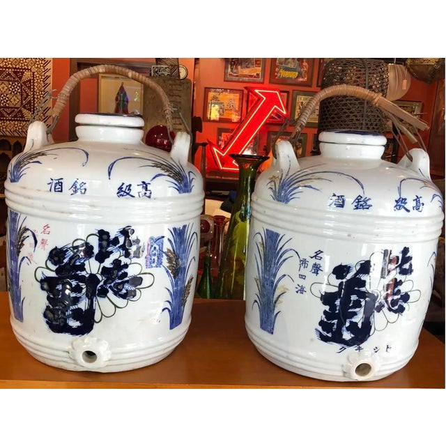 Set of three ceramic sake barrels. 12ʺW × 12ʺD × 15ʺH