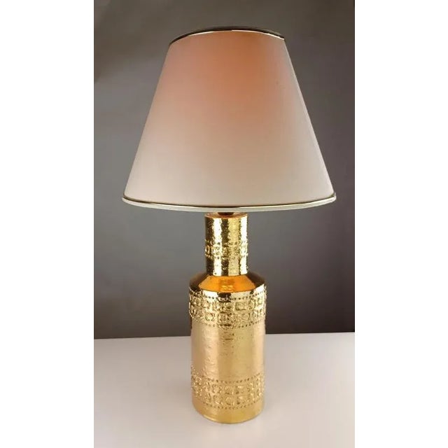 Bitossi Gold Glazed Table Lamp with Decorative Hand Incised Bands, 1960s These hand incised Bitossi table lamps with their...